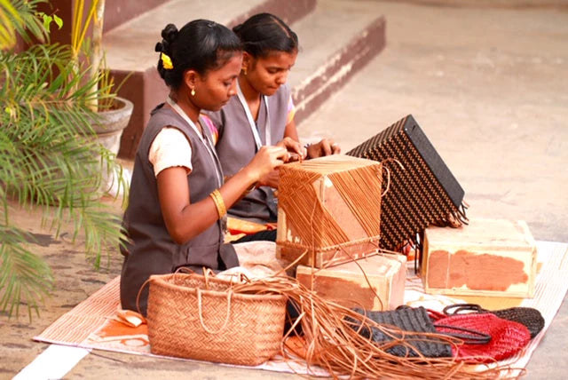 Dragon Diffusion weavers making traditional leather handbags