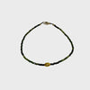 Green tourmaline bracelet with single gold bead and clasp