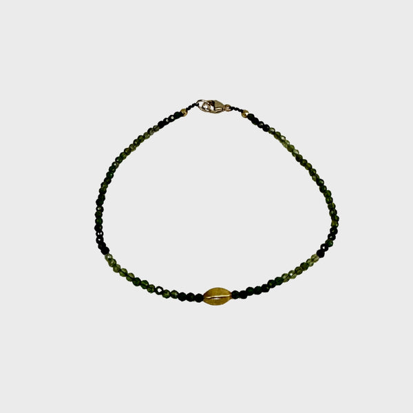 Green tourmaline bracelet with single gold bead and clasp