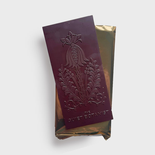 The quiet botanist wildflower dream chocolate bar 66% organic dark chocolate layered with a mix of wildflowers made in the USA vintage wrapped chocolate
