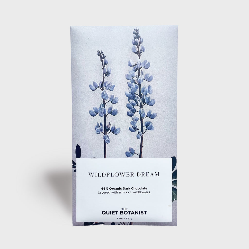 The quiet botanist wildflower dream chocolate bar 66% organic dark chocolate layered with a mix of wildflowers made in the USA vintage wrapped chocolate