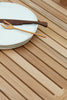 Close up of AH902 Outdoor Dining Table, Square, FSC™-certified teak, untreated, Designed by Alfred Homann for Carl Hansen & Søn 